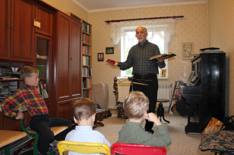 Grandpa preaching at family devotions