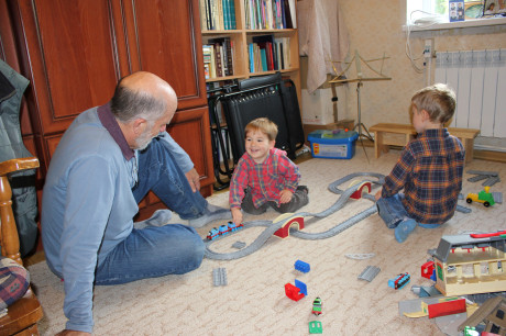 All boys like to play with trains.