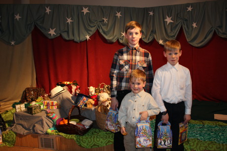 Three older boys at the children's Christmas program.