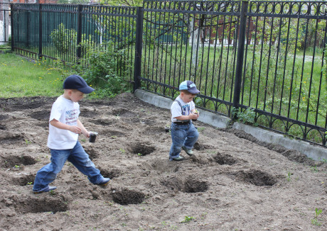 Helping Mama plant peppers