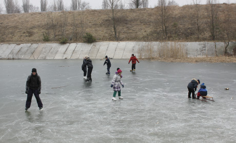 Sashko (far left) and Yurko (orange coat) ice skating for the first time ever