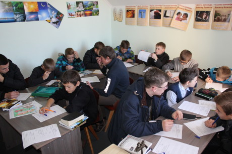 Sashko and Yurko's class: 18 boys cramped into a tiny SS classroom at the local Baptist church (Sashko in the foreground in glasses and Yurko center back reading over his test).